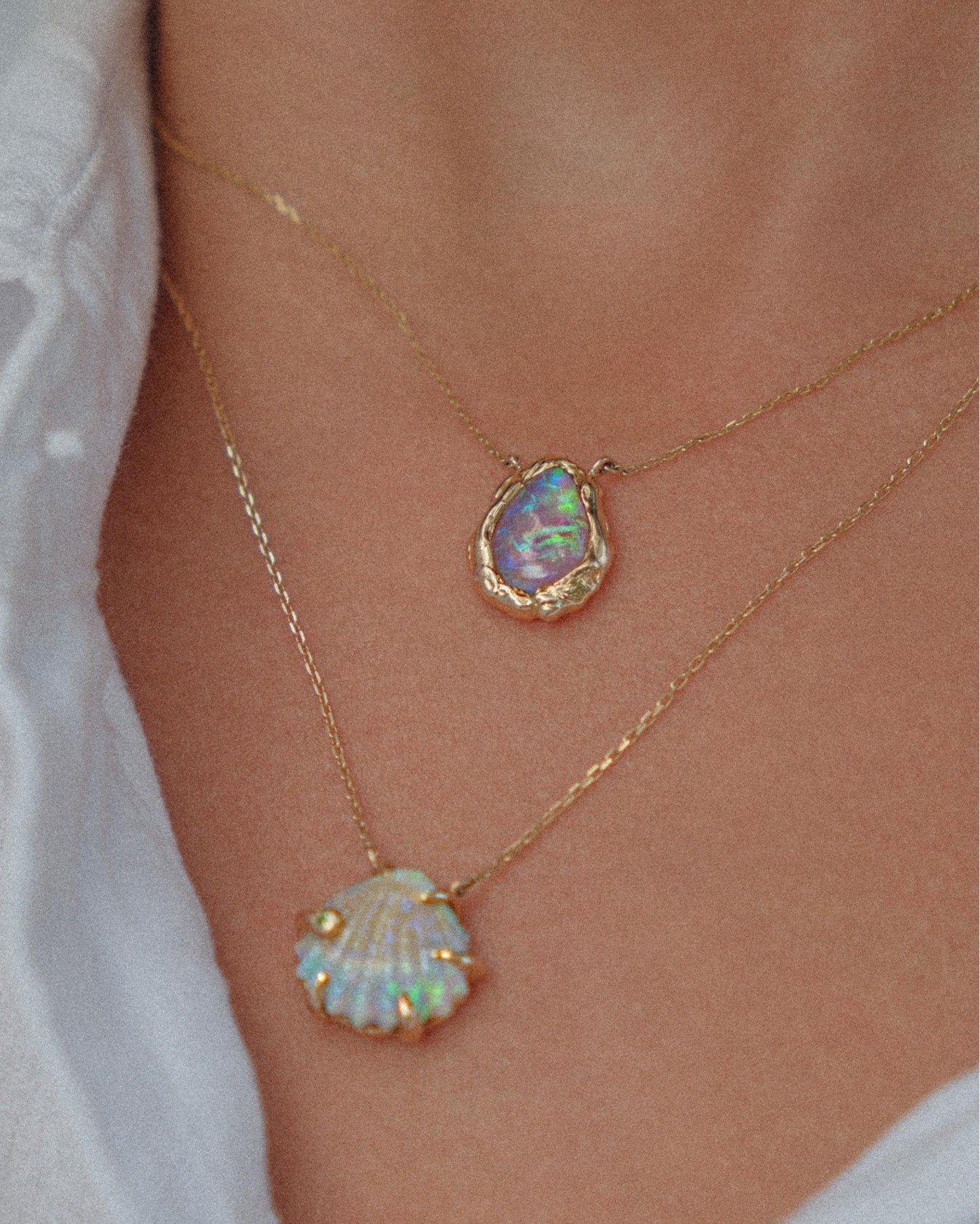 Close-up of the Opallios Sea Shell Necklace – polished gold finish